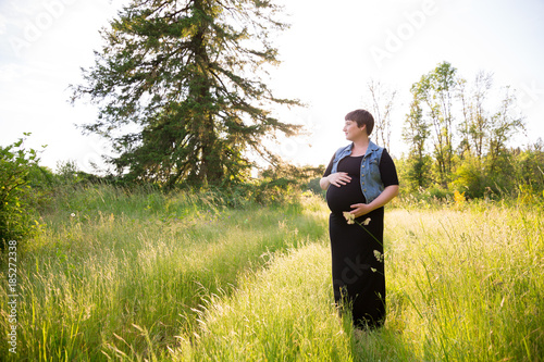 Pregnant Woman in a Field for Maternity Photos