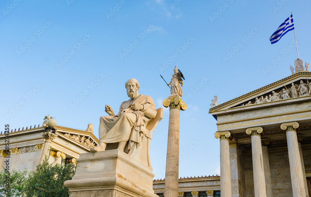 Ancient marble statue of the Greek philosopher Plato background of Greek architecture. 