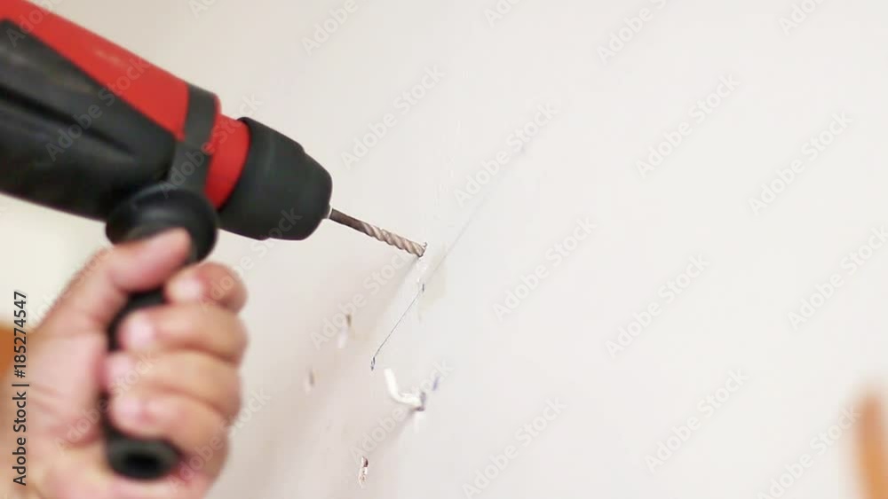 Electric drill piercing a wall. But it accidentally holes a pipe and comes out of water. Original audio.