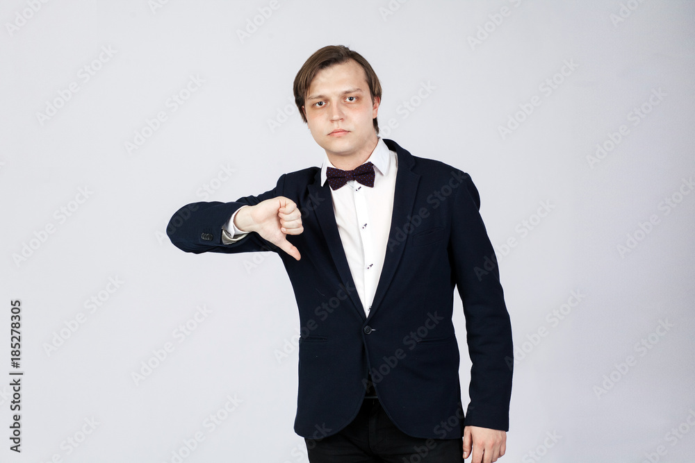 Disappointed business man with thumb down Disappointed business man with thumb down