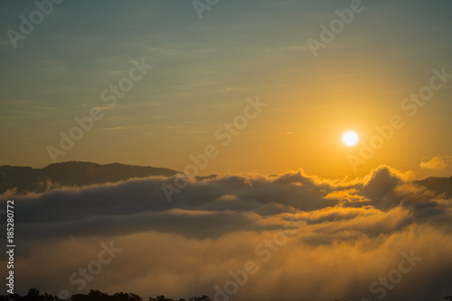 Fog and sun on the mountain view point photo