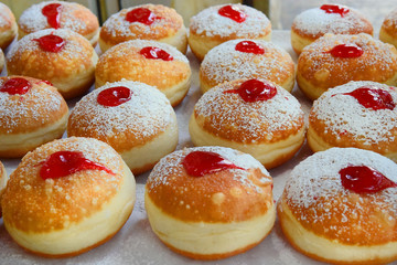 traditional hanukkah sufganiyot with strawberry jelly