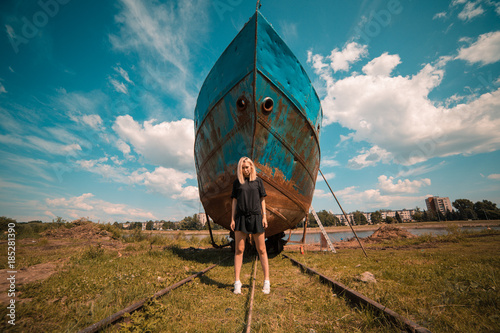 Girl in front of a ship