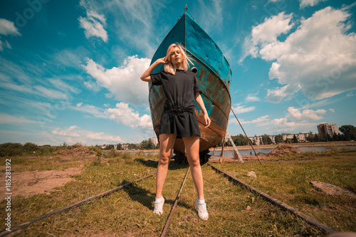 Girl in front of a ship