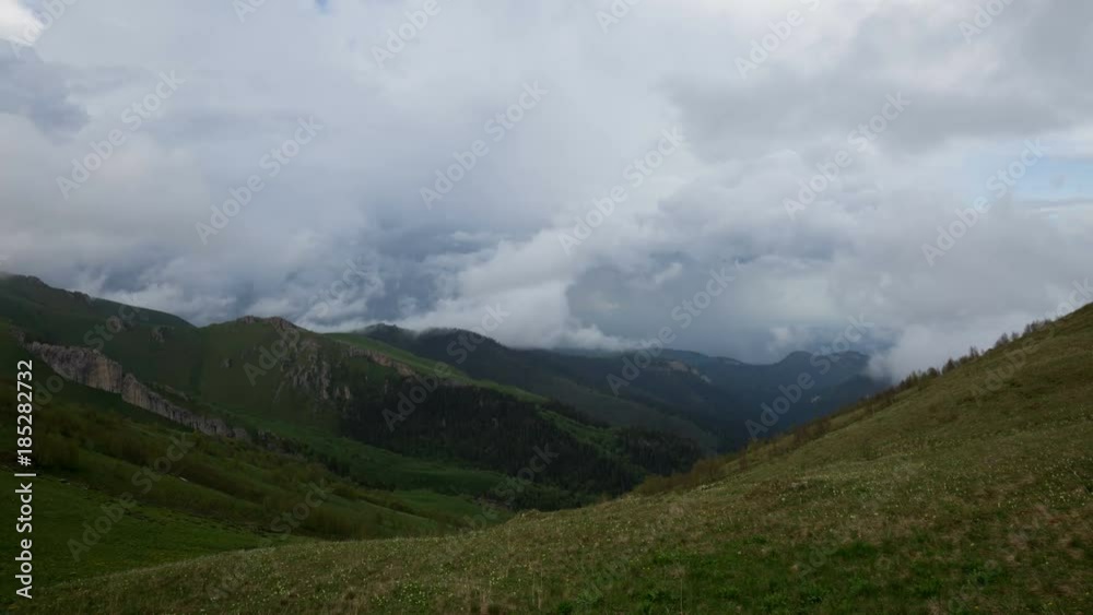 Russia, time lapse. The formation and movement of clouds over the summer slopes of Adygea Bolshoy Thach and the Caucasus Mountains Russia, time lapse. The formation and movement of clouds over the summer slopes of Adygea Bolshoy Thach and the Caucasus Mountains