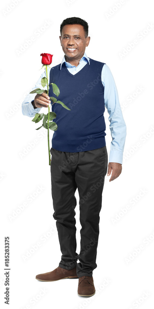 Mature African-American man with beautiful rose on white background Mature African-American man with beautiful rose on white background