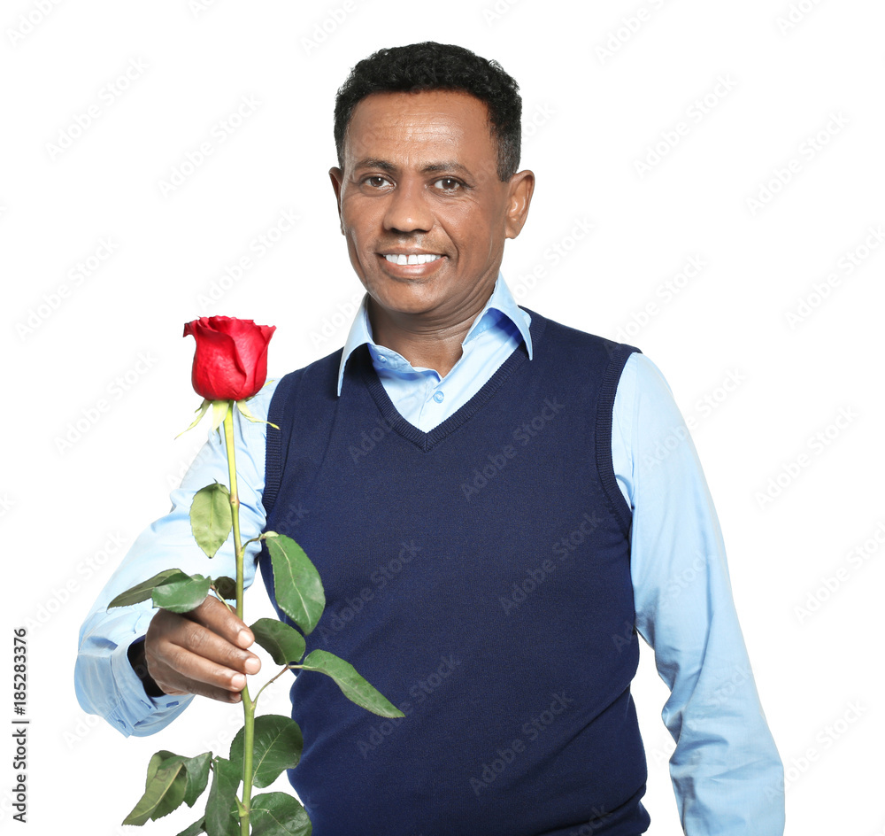 Mature African-American man with beautiful rose on white background Mature African-American man with beautiful rose on white background
