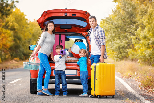 Happy family with luggage n...