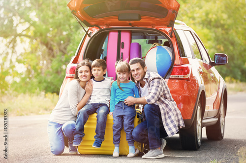Happy family with luggage n...