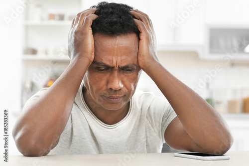 Troubled mature African-Ame...