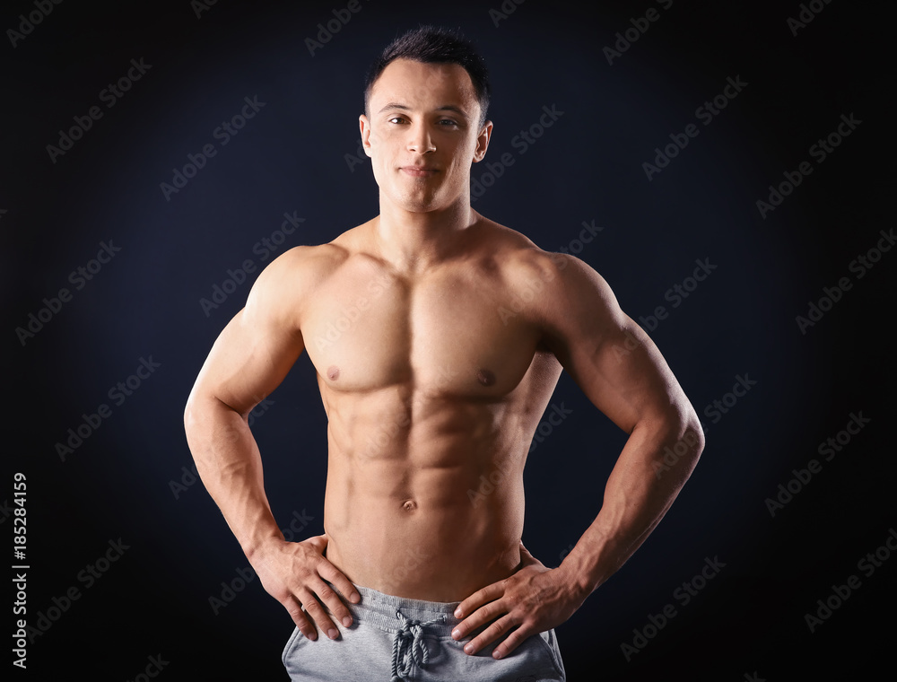 Sporty young man on black background Sporty young man on black background