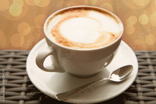 capuchino coffee close up. art heart coffee on wood background vintage style