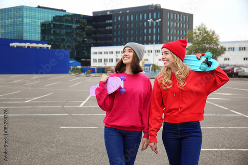 Two happy hipster girls wit...
