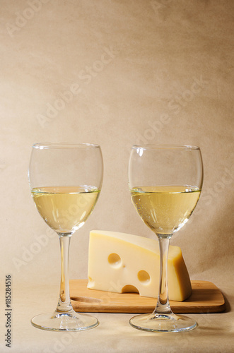 cheese, grapes and two glasses of the white wine