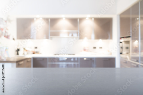 Empty steel top table with blur kitchen background. Ready for product montage.