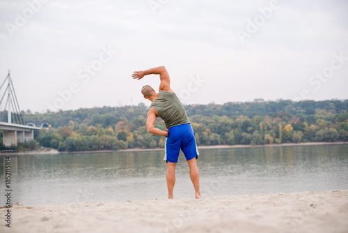 Ahlete work out on beach photo