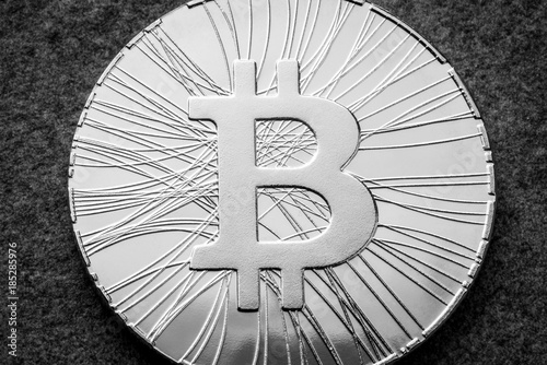 Cryptocurrency bitcoin coin. White and black macro view photo