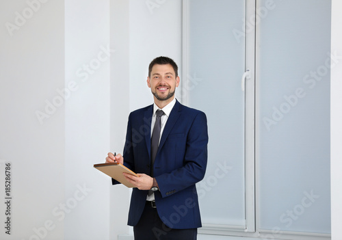 Young male notary with note...