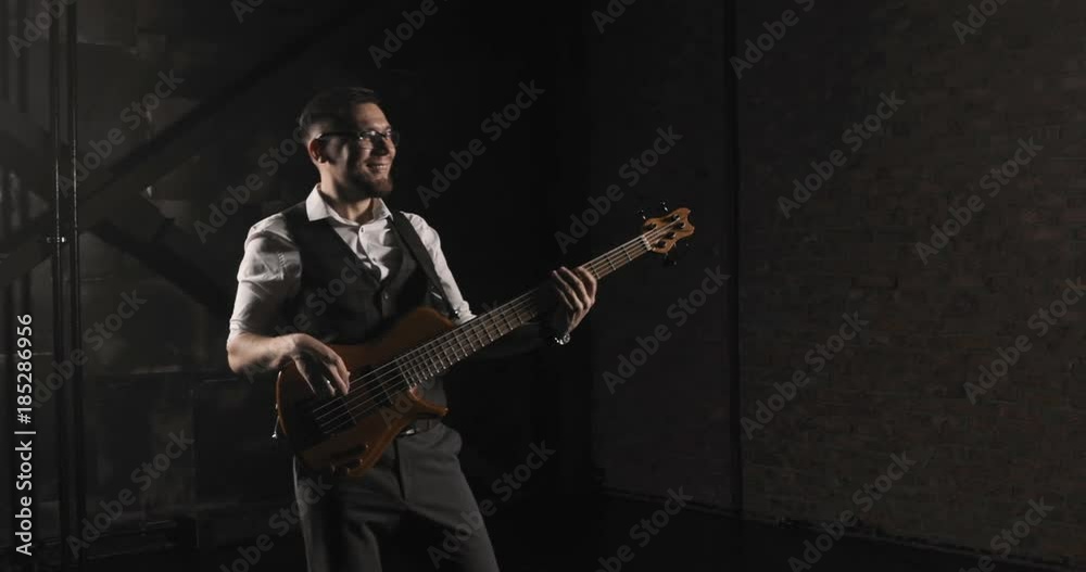 Musician plays rock music. The energetic game of rock style. Black background. Musician plays rock music. The energetic game of rock style. Black background.