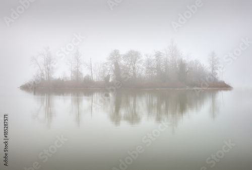 Mist Island. Early morning calm on the Fraser River, British Columbia.