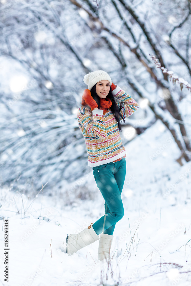 Winter young woman portrait. Beauty Joyful Model Girl laughing and having fun in winter park. Beautiful young woman outdoors. Enjoying nature, wintertime Winter young woman portrait. Beauty Joyful Model Girl laughing and having fun in winter park. Beautiful young woman outdoors. Enjoying nature, wintertime