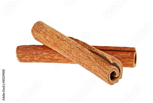Two cinnamon sticks isolated on white background