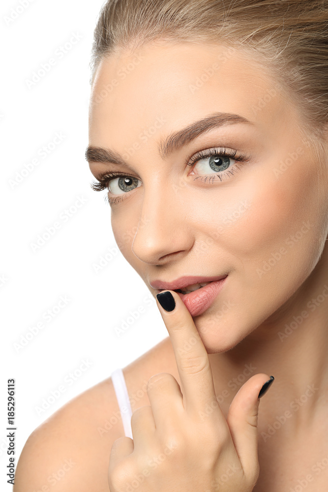 Beautiful woman with long eyelashes on white background