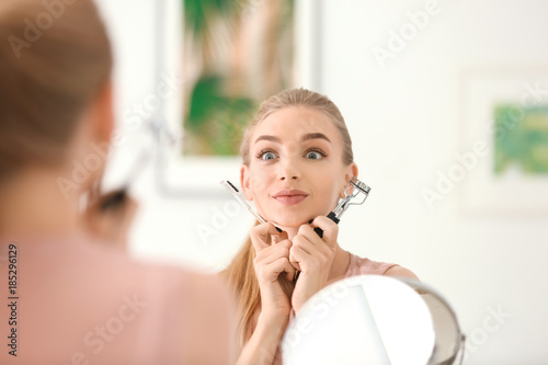 Emotional young woman with ...