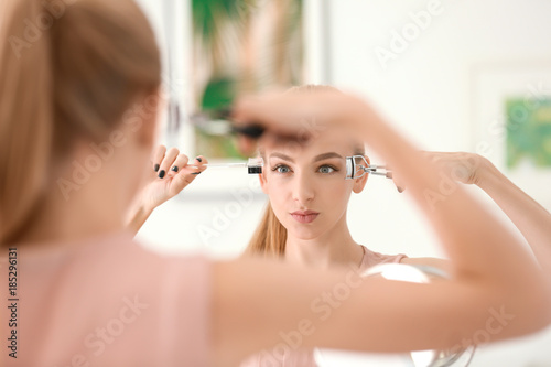 Beautiful young woman with ...