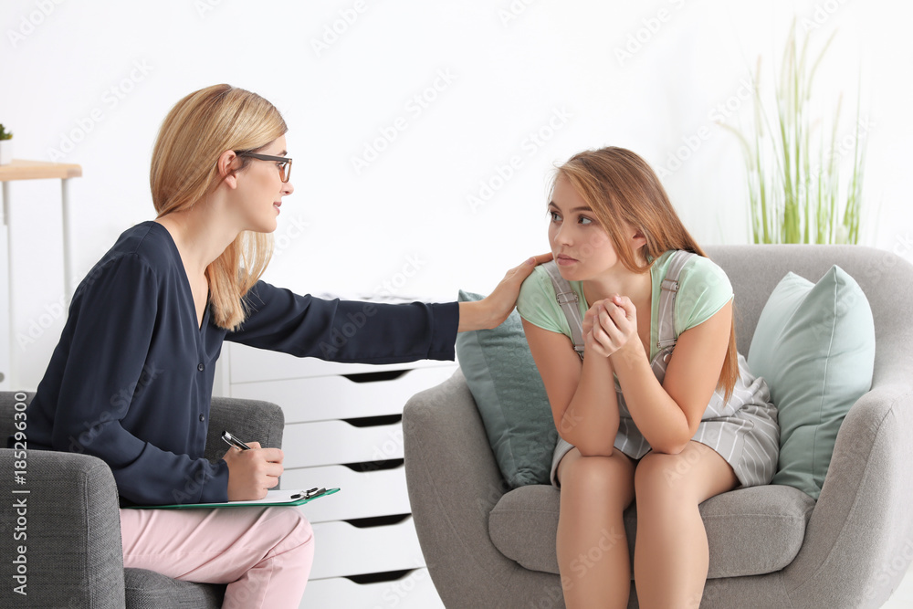 Psychologist working with patient in office Psychologist working with patient in office