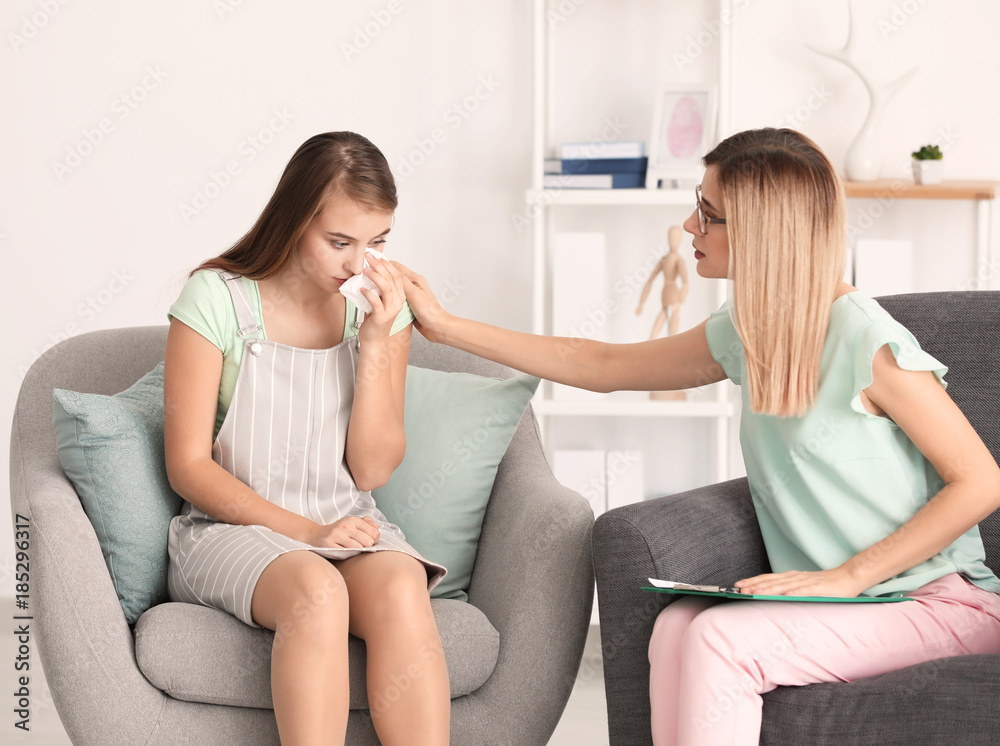 Upset young woman at psychologist's office Upset young woman at psychologist's office