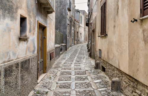 Fototapeta Naklejka Na Ścianę i Meble -  Typical narrow stone street in the medieval historical center of Erice, province of Trapani in Sicily, Italy