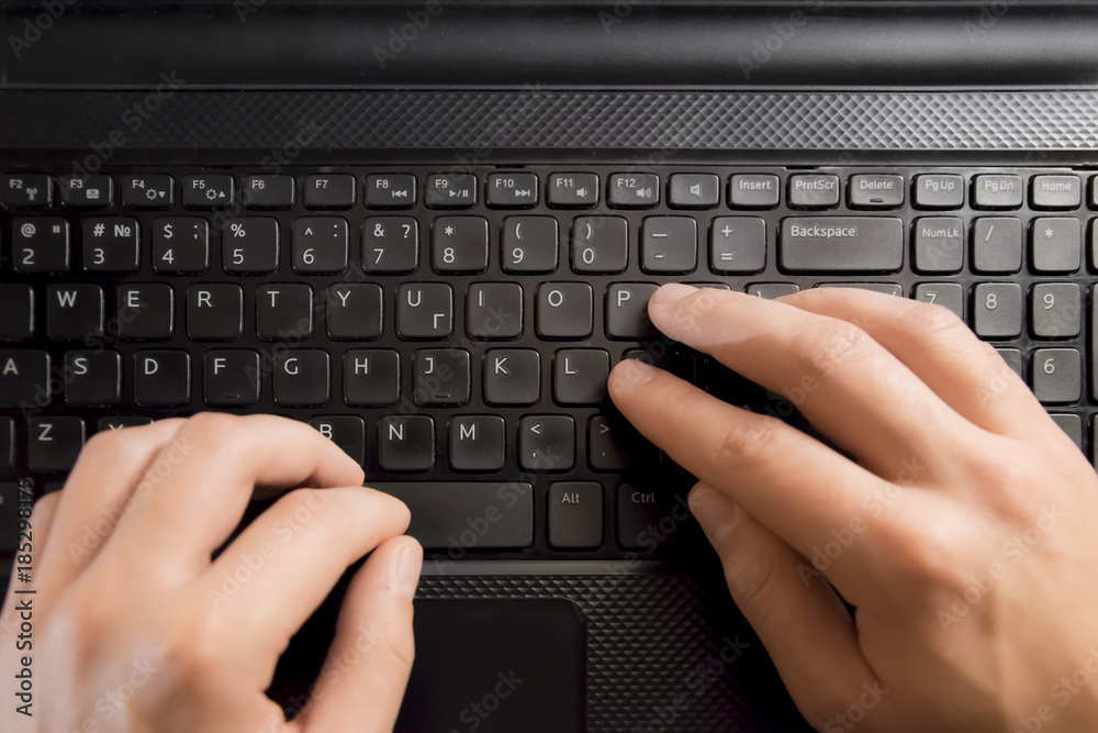 Fingers pressing keyboard key on laptop. Hands with computer Fingers pressing keyboard key on laptop. Hands with computer