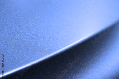 Fotografi Fragment of blue steel car bodywork, vehicle silver paint coating texture, selec