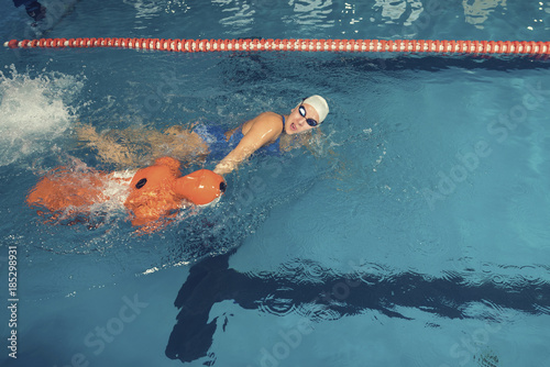 Water Rescue Training Trainer and Training Dummy in a Pool