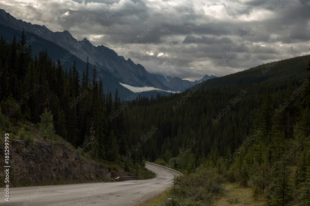 Road trip under a stormy sky in Jasper Alberta Rocky Mountains landscape