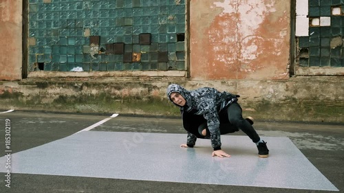 Breakdancer dancing on the street. 4K photo