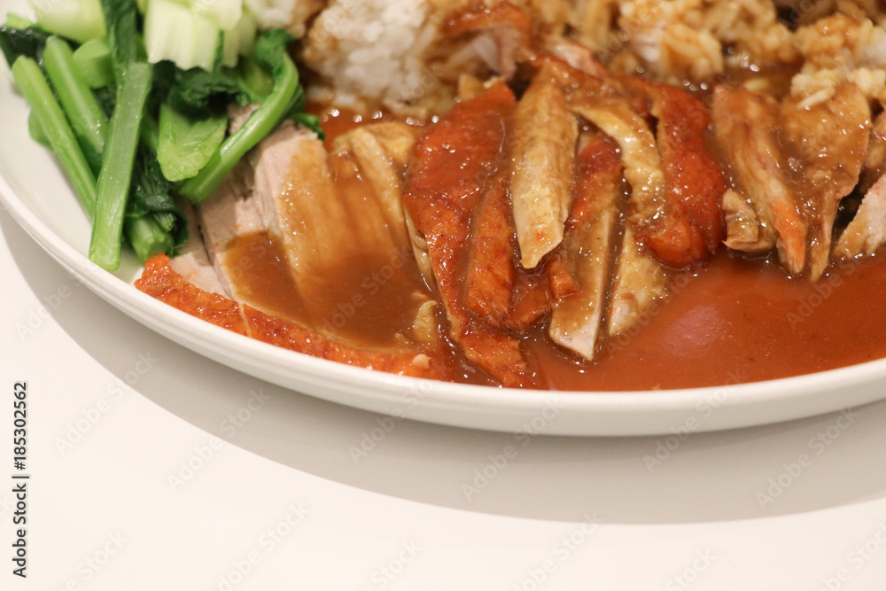 Roasted duck with sauce on rice in white plate closed up Chinese delicious lunch food Roasted duck with sauce on rice in white plate closed up Chinese delicious lunch food