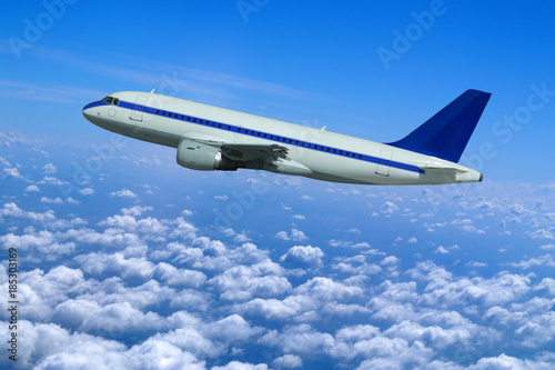Passenger aircraft in flight at high altitudes above the clouds