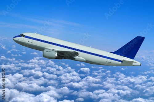 Passenger aircraft in flight over the clouds