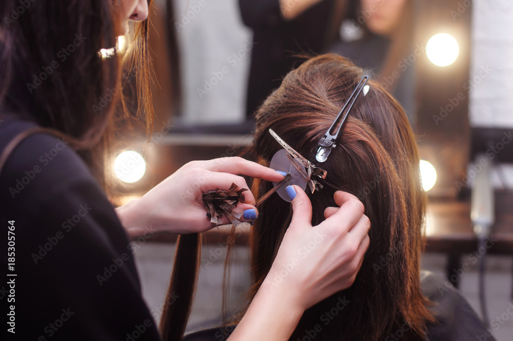 hair extension for brunette girls in the salon Stock Photo | Adobe Stock