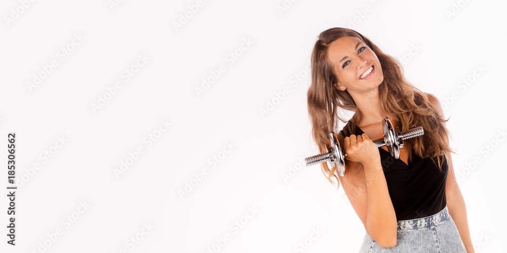 Beautiful and smiling girl doing some exercise. Copy space horizontal size photo. Beautiful and smiling girl doing some exercise. Copy space horizontal size photo.