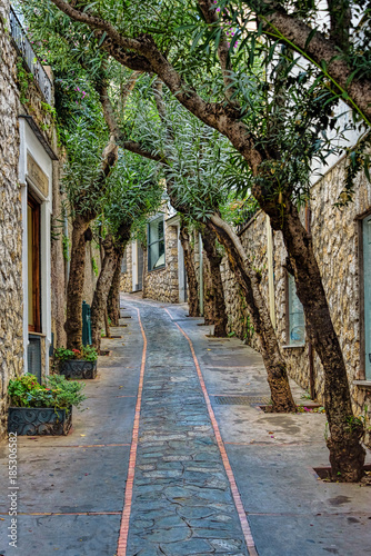 Capri Island street under cloudy sky after storm