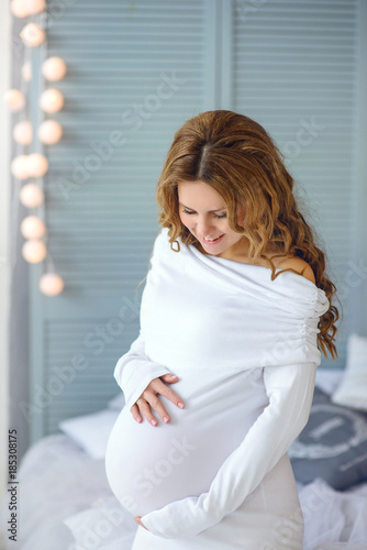 beautiful pregnant woman smiles