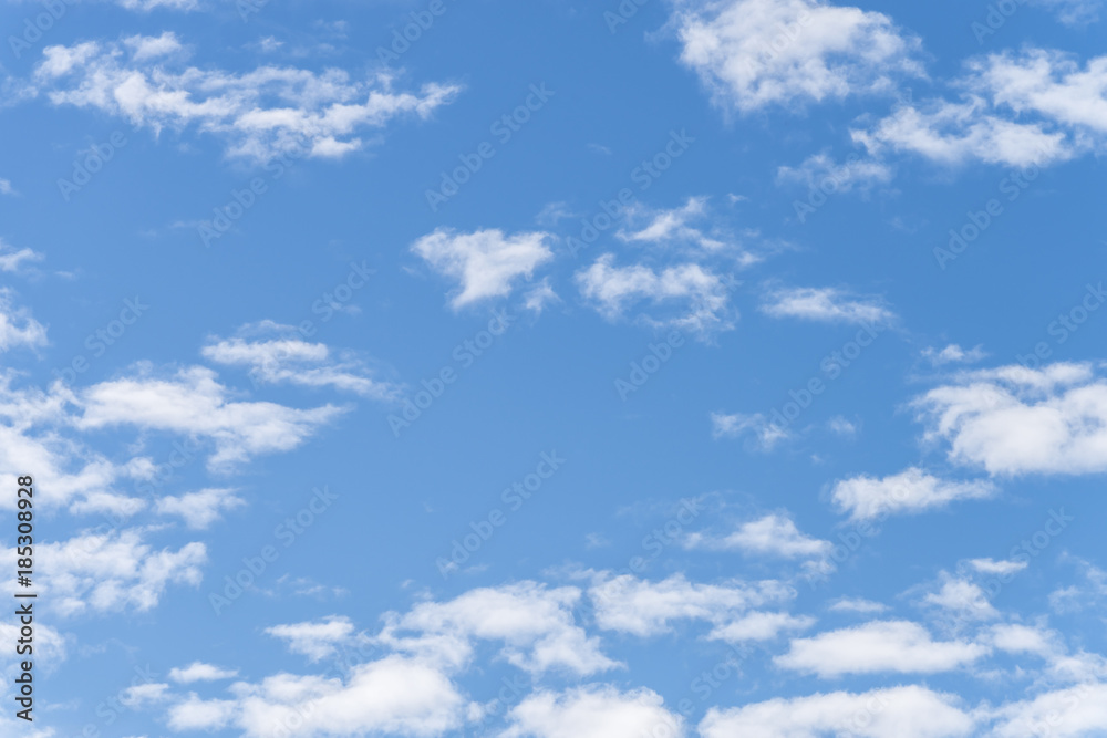 Fototapeta premium clear blue sky with plain white cloud with space for text.