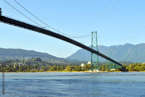 Great afternoon at Stanley park in Vancouver, BC, Canada. In this shot the Lions gate bridge that pass over the park and connect two parts of the city photo