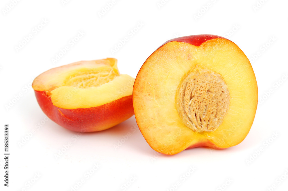 Fresh half of plum. Use it for a health and nutrition concept. Fresh half of plum. Use it for a health and nutrition concept.