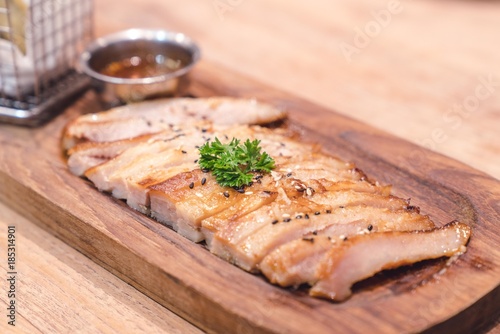 Pork grill steak slice on wood plate