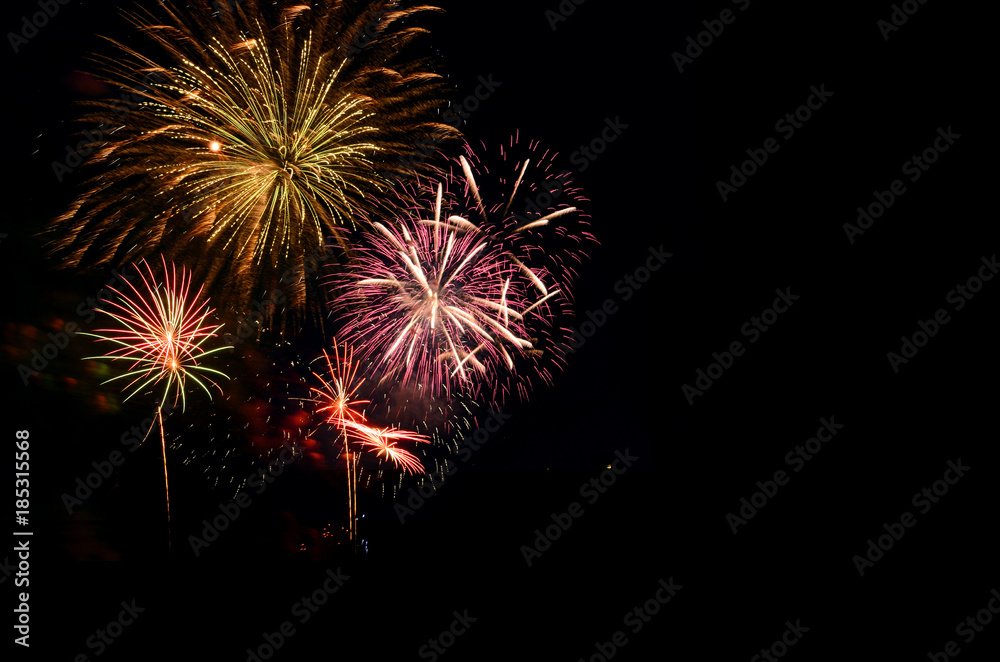 Fireworks celebration and the midnight sky background.