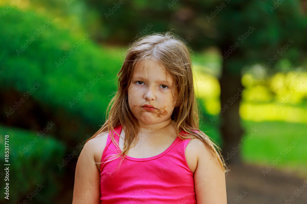 Beautiful little girl on the street through Beautiful little girl on the street through